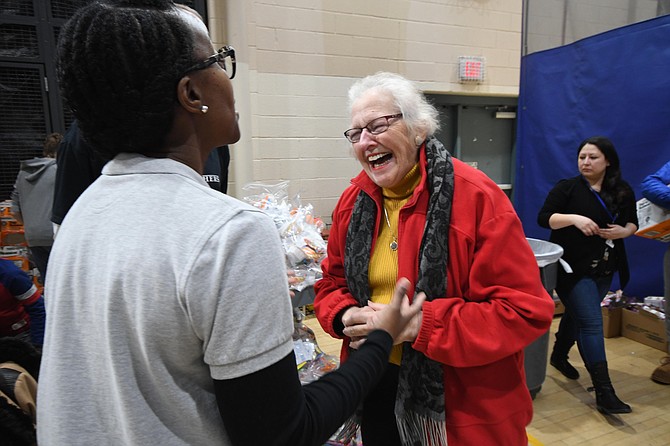 Mason District Supervisor Penny Gross, right, talks with volunteer Caleen Sullivan of the Educational and Charitable Foundation, Monday, Jan. 21, 2019, during Volunteer Fairfax’s 10th annual Give Together at the at the Jewish Community Center of Northern Virginia in Fairfax. Several hundred volunteers took part in the event held in observance of the Martin Luther King Jr. National Day of Service.