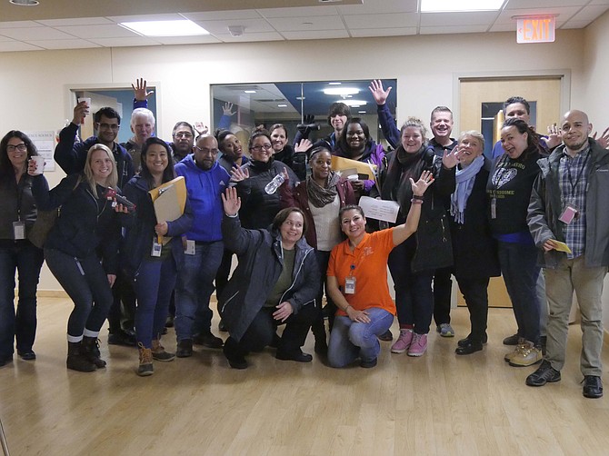 A group of volunteers pauses for a group photo before heading out to begin the 14th annual Arlington Point in Time (PIT) homeless count Wednesday, Jan. 23. This is part of a nationwide effort each year that takes place in January.