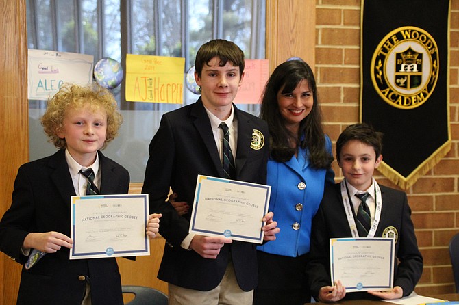 From left: 3rd Place Finisher Francisco Gonzalez-Berrington (6), 2nd Place Finisher Will Lankenau (8), GeoBee Moderator and 5th Grade Teacher Kelly Tanzi, and School Champion Areg Louis Devoyans (5).