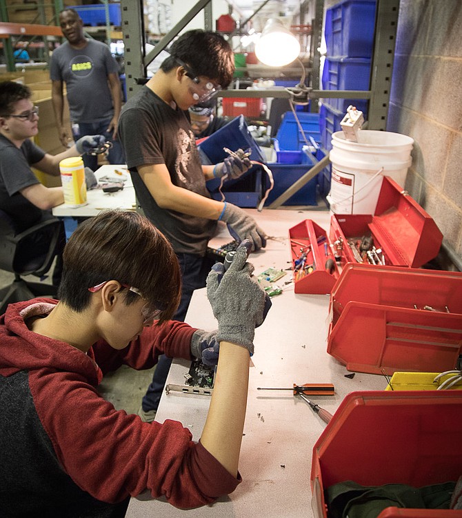 Workers at Securis recycle old data devices.