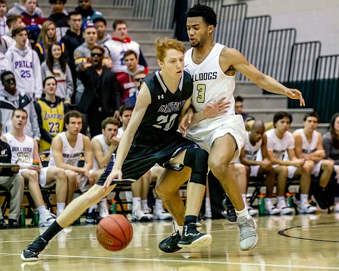 Chantilly’s Derek Smith #20 pushes off Westfield’s Marshall Reed #3.