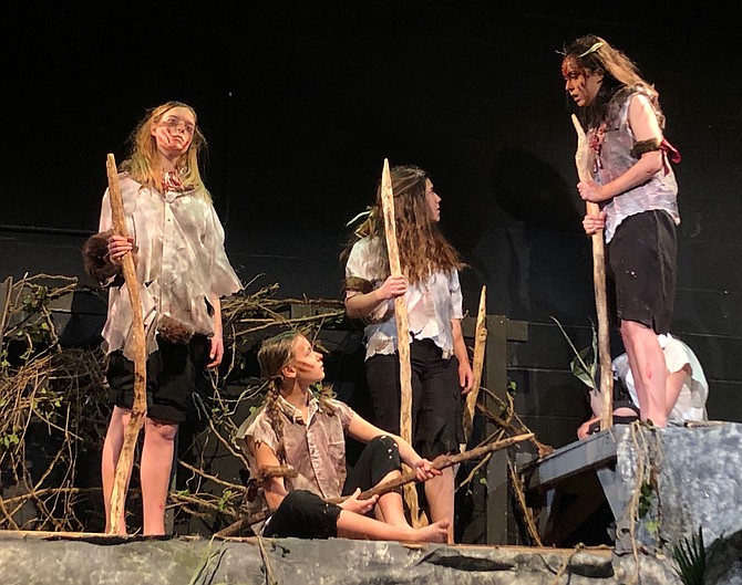 From left:  Bryn Kirk, Carenna Slotkoff, Alexandra Lagos, Kristen Waagner in McLean High School's production of The Lord of the Flies.