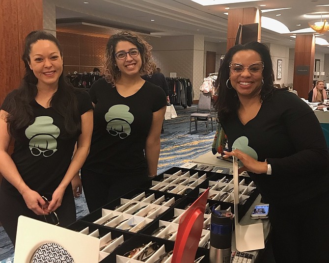 Elizabeth Crull, Andrea Portillo and Mia Suite of eye2eye in Del Ray at the 15th anniversary Alexandria Warehouse Sale Feb. 2 at the Westin Hotel.