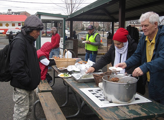 Maryam Bibi serves homemade lunch to SEEC workers in south Arlington.