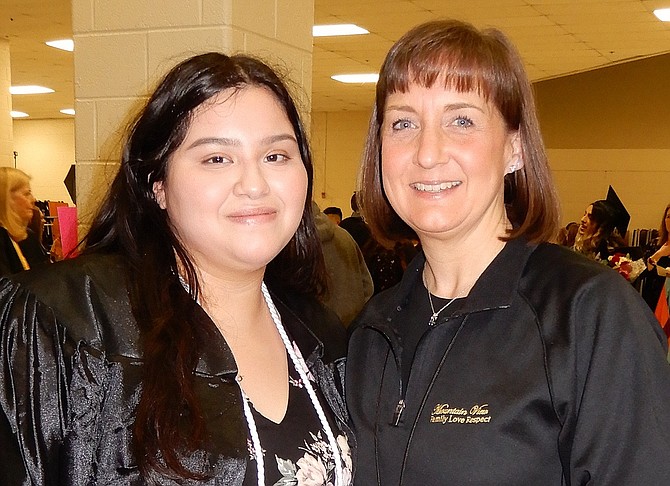 New grad and student speaker Ashley Martinez with school librarian Becca Ferrick.