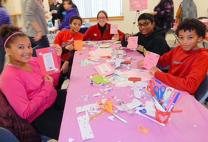 Holding the Valentines they made are (from left) Waples Mill Elementary students Nicole and Eric Holtz Djiba and their mom Sara Holtz, and Franklin Middle students Aaron Selvan and David Holtz Djiba.