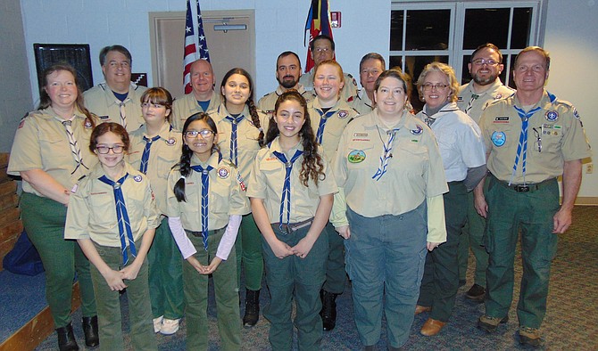 The girls of Troop 893 with their Scout leaders.