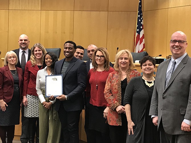 Lead Pastors of Life Ticket Church, Dorian and Leah Baker (center) stand with Town of Herndon Mayor Lisa C. Merkel, Vice Mayor Sheila Olem (right of Baker), other Councilmembers and town staff after accepting the Town of Herndon Proclamation "African American History Month February 2019" during the Herndon Town Council Meeting on Feb. 12.