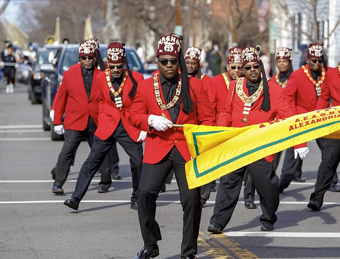Members of the Magnus Temple 3 Marching Club participate in the 287th George Washington  Birthday parade.