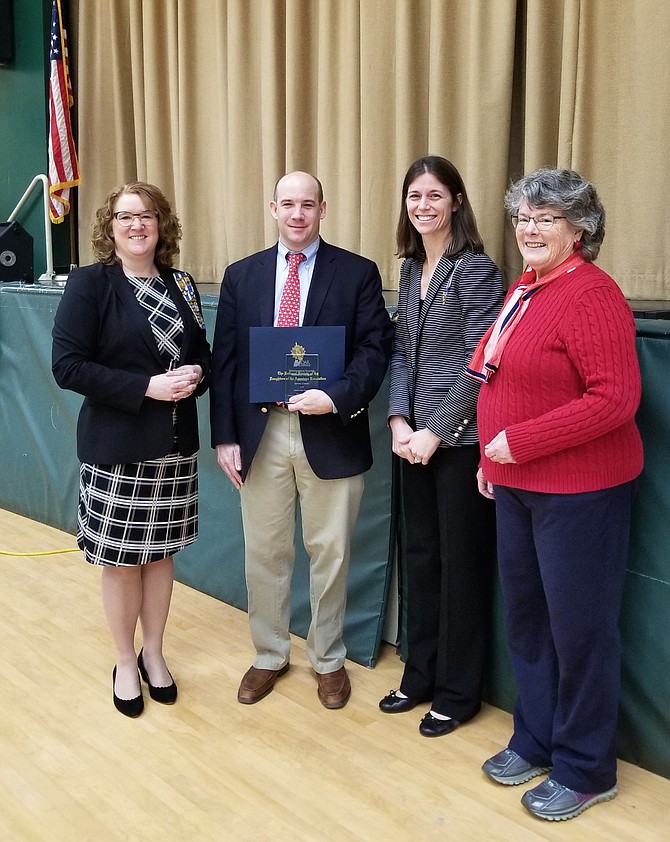 DAR Chapter Members presenting Kevin Cyron with the Outstanding Teacher of American History Award. Pictured, from left, are Chapter Registrar Wendy Stark, Outstanding Teacher Mr. Cyron, Chapter Regent Beth Boswell, and Chapter Historian Maureen Jenkins.