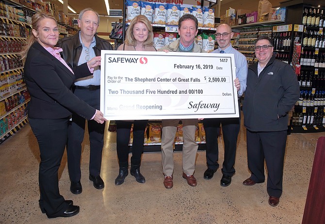 The Shepherd Center of Great Falls accepts a donation to their nonprofit organization from Safeway, during the store’s remodeling celebration. Safeway also made a donation to Best Buddies Langley, a group from Langley High School that raises funds while raising awareness to support persons with intellectual and developmental disabilities.