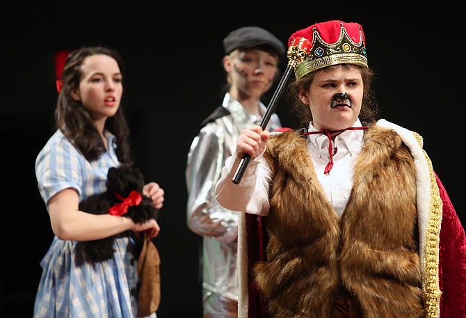 From left, Kiley Hatch, Edith Barvick, Eli Crishock in Oakcrest High School’s production of the ‘The Wizard of Oz.’