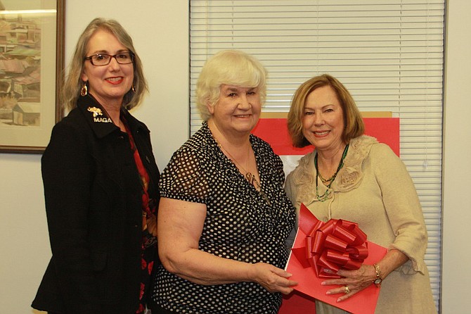 From left: Linda App, CRWC 1st vice president, and Eileen Brackens, CRWC president, present Jodi Rushton, NFRW president, with over $2,200 in member donations for the Pathfinder, Inc. scholarship and internship programs for conservative college students in memory of CRWC member Loree Gunn.