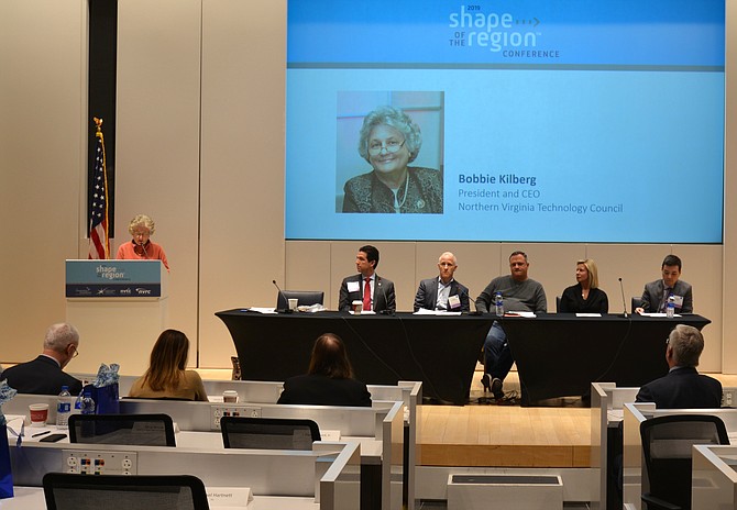 From the podium, Bobbie Kilberg, president and CEO, Northern Virginia Technology Council, moderates the “Tech Talent Pipeline” topic with panellists (from left) Steve Partridge, VP of Workforce Development at Northern Virginia Community College, Ken Eisner, founder of Amazon Web Services’ Educate, to accelerate cloud learning, John Wood, CEO and chairman of the Telos Corporation, Lauren Recinos, a continuing education tech student from Ashburn, and Ray Khuo, chief human capital officer, Altamira Technologies Corporation.