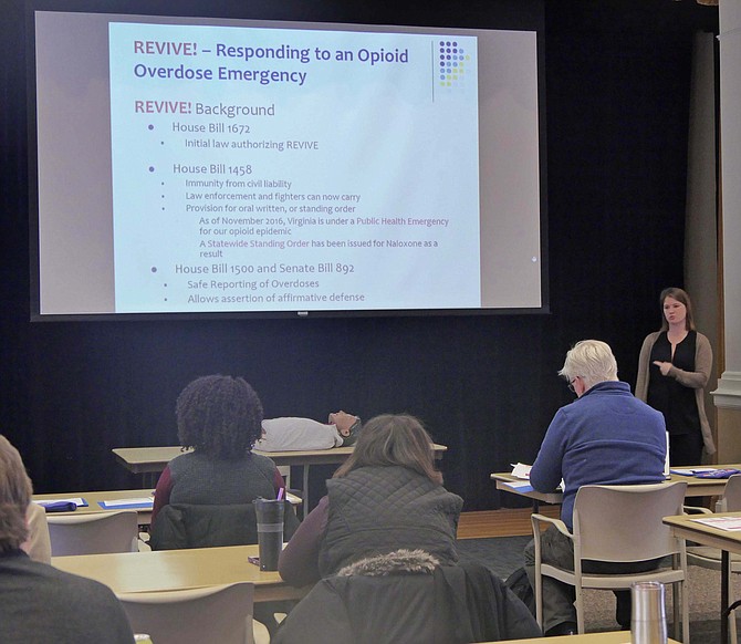 Emily Siqveland offers REVIVE! Opioid Overdose and Naloxone Education training to community attendees.