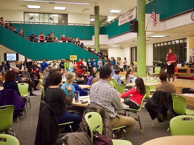 Elisabeth Harrington addresses the crowd of parents, teachers, and students.