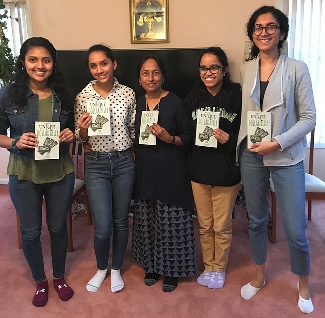 Author Chitra Krishnamurti, also known as Sea Kay, center, is surrounded by some of the young women who helped illustrate and edit her book “Unique Dollar Billy.” Sea Kay held a book launch part at her Potomac home Sunday, March 10.