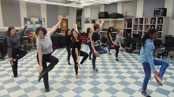Choreographer Reyna Osborne leads Bishop Ireton dance students in rehearsal for “Curtains.”