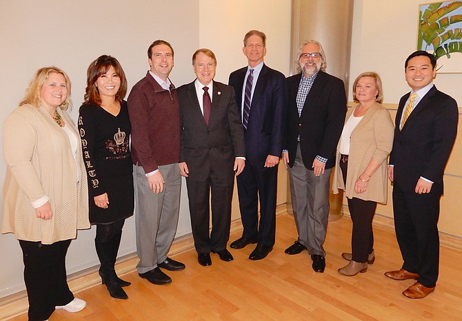 At Rob Stalzer’s welcoming reception from Fairfax City were (from left) Council members Jennifer Passey, So Lim and Jon Stehle; Mayor David Meyer; Stalzer; and Council members Michael DeMarco, Janice Miller and Sang Yi.