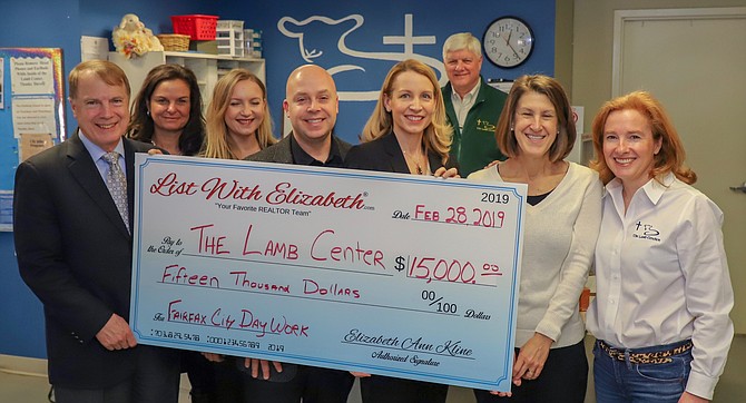 The check presentation: (From left) David Meyer (Fairfax Mayor), Denise Johnson (team agent), Xenia McGregor (team agent), Kevin Kline (CEO/President), Elizabeth Ann Kline (team leader), John MacPherson (Lamb Center Executive Director), Sharon Mills (team agent), and Tara Ruszkowski (Lamb Center Board Chair).