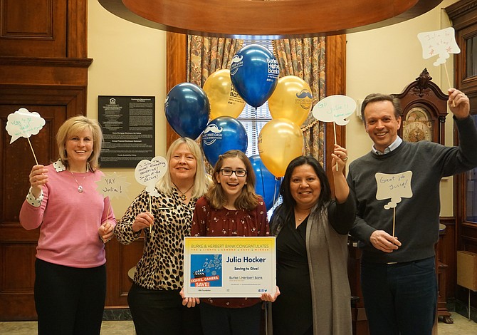 Mother, Michelle Hocker; one of the judges – Alexandria Film Festival Executive Director Patti North; Julia Hocker; Area Manager Sandra Vasquez; and father, Guy Hocker, congratulate Julia.