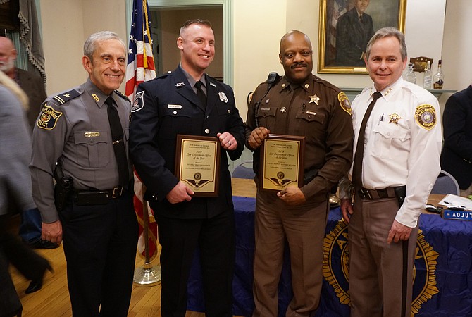 Alexandria Police Officer Sean Gallagher and Alexandria Sheriff’s Office Master Deputy Jeffrey Hunter, center, with Police Chief Michael Brown and Undersheriff Tim Gleeson following the presentation of the Law Enforcement Officer of the Year awards March 13 at the American Legion Post 24 in Old Town.