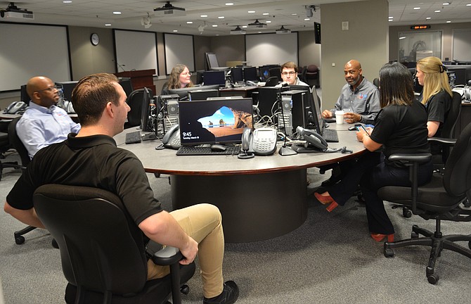 The calm before the storm. Staff from the county’s Office of Emergency Management “at work” in the Office of Emergency Management’s Alternate Emergency Operation Center, giving insight into the department’s operations before a state-wide tornado drill.