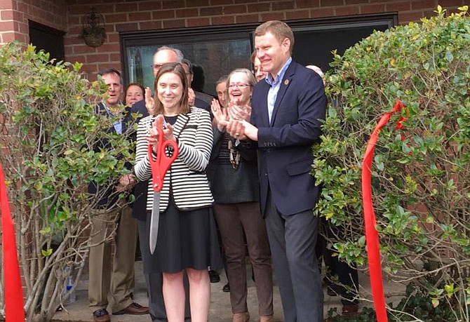 Alexis Feeney Tallman, chairwoman of Good Shepherd Housing and Family Services Board, and Jeff McKay, Lee District supervisor at March 14 ribbon-cutting.