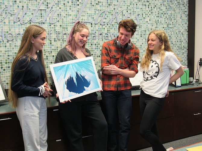 From left, South Lakes High School's Regional Scholastic Art Awards recipients: Katia Pavlova, 16, Silver Key; Laela Huddleston, 17, Gold Key; James Bailey, 18, Gold Key; and Selin Boybeyi, 18, Gold and Silver Key; winners give their feedback on  "Cold Hell," by student artist Huddleston during a break from art class.