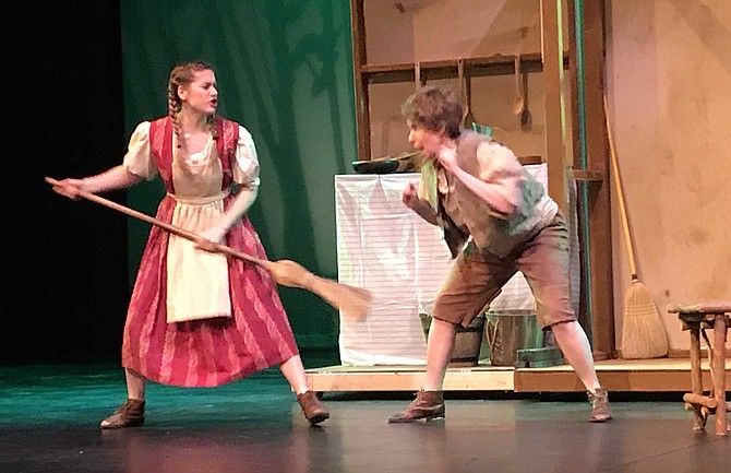 Kristi Spicer as Gretel chases Jennifer Matthews as Hansel.