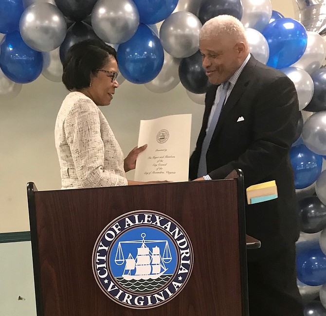 Deputy City Manager Debra Collins presents a proclamation to William Chesley, deputy director of Recreation Services, on the occasion of his retirement after 38 years of public service at a reception March 22 at the Nannie J. Lee Center.