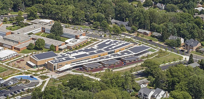 Some Fairfax County schools may soon sprout solar panels on their rooftops, like Discovery Elementary School in neighboring Arlington.