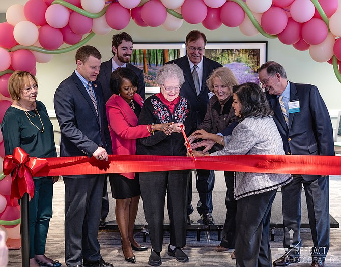 Betty Christman, President of the Greenspring Resident Council; Jeff McKay, Fairfax County Supervisor; Alex Robbins, Office of Congressman Gerry Connelly (back); Donna Epps, Continuing Care Administrator; Peggy Trotter, Garden Ridge Resident; Jackson Bain, Greenspring Board Chair; Vivian Watts, Virginia House of Delegates; Chandra Kumar, Executive Director; and Roy O’Connor, Greenspring Board Member, gather to celebrate the opening of Dogwood Commons, Greenspring’s new continuing care building, which provides an array of person-centered services to help residents achieve optimal health outcomes.