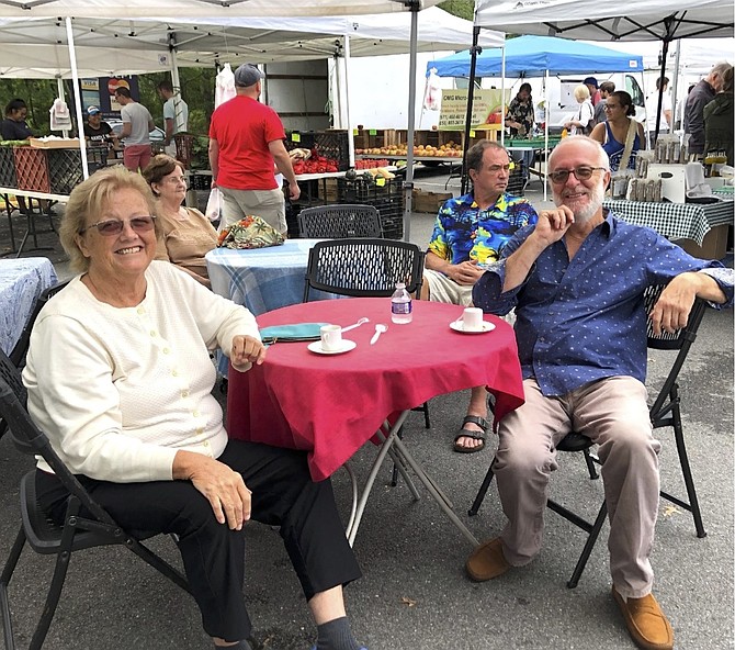 Kathleen Murphy and her husband Konstantine Tsombikos, 
enjoying their Saturday morning at the Great Falls Farmers Market.