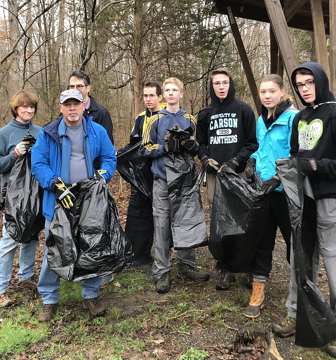 Environmental heroes, Christine Westbrook, Bill Wilde, John Vierow, Matt Vierow and students Owen, Will, Emma and Thomas of South Lakes High School, arm themselves with black plastic bags ready to rid Herndon's parks, trails and bio ponds from litter, so it doesn't flow downstream into the Potomac River and the Chesapeake Bay.