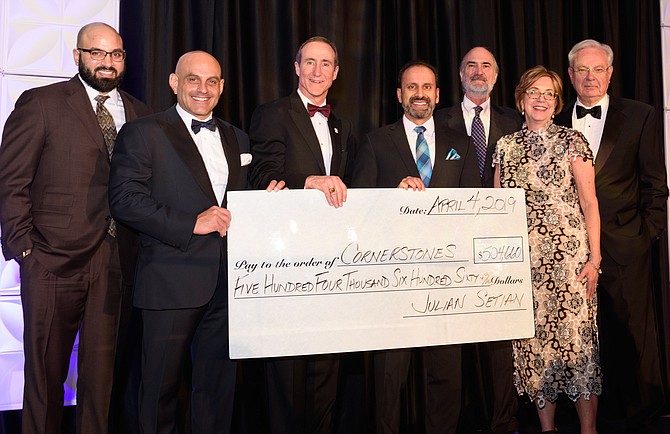 From left, Amir Hawa, Cornerstones Board and Agency Relations Manager, Gala Chair, Julian Setian, Mark Ingrao, President and CEO Greater Reston Chamber of Commerce, Charles Kapur, Past Chair GRCC, Larry Schwartz, Cornerstones Vice Chair, Kerrie Wilson, Cornerstones CEO, and Phil Tobey, emcee, admire the generosity of supporters with an all-time record-breaking $504,660 raised for Cornerstones.
