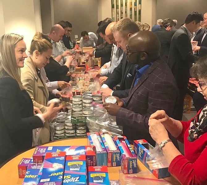 A team of 40 Allstate volunteers and seven Assistance League volunteers packed nearly 500 bags of food for children.