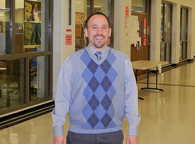 Centreville Principal Chad Lehman standing outside the school library.