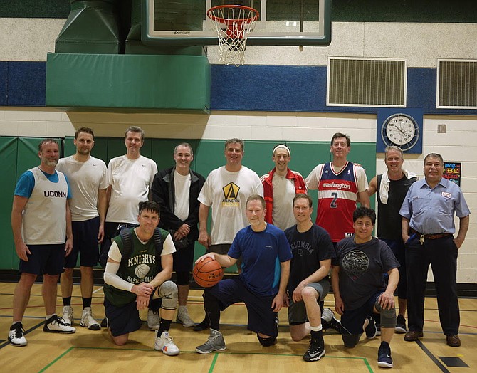 The players, with their biggest fan, the senior janitor at Nottingham, far right. “They are the best,” said Ryan Paquet, “they run a tight ship here, keep everything beautifully maintained.”