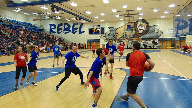 Teachers from Mosby Woods take on Providence Elementary School in a charity basketball game.