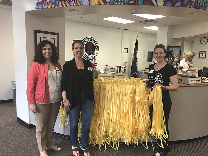 Lynn Sabia from Mindful Memorials along with the PTSA President Beth Eachus and Julie Shepard from FFXPTA were present during the construction of the ribbons in memory of service members killed since September 11, 2001.