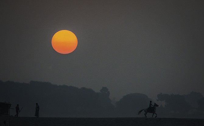 “Rider at Sunrise” by Rick Reda