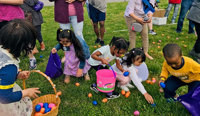 Children collect eggs at The Biggest Easter Egg Hunt April 20 at Mount Vernon High School. The family event was sponsored by Washington Community Church and featured more than 20,000 candy-filled eggs.