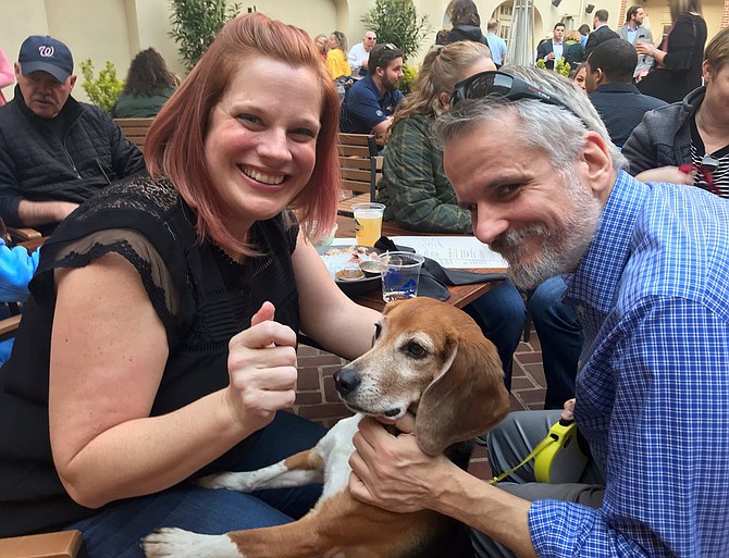 Crystal and Dave Nosal with Tucker at the Barks, Brews and Bites fundraiser for the Alexandria Police Foundation and the K-9 retirement program April 4 at The Alexandrian Hotel courtyard.