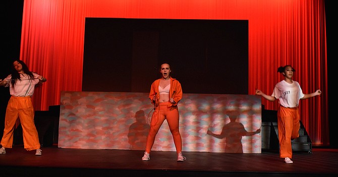 From left: Nicole Romero, Ellie Berenson and Sophia Bailey in Washington Lee High School’s perormance of “Legally Blonde” on Saturday, April 27.