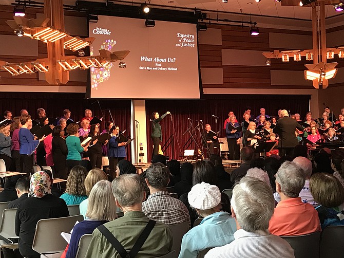 The Reston Chorale, conducted by David B. Lang, sings "What About Us?”, music and lyrics by Pink, Steve Mac and Johnny McDaid with Malika Evans, Soloist.