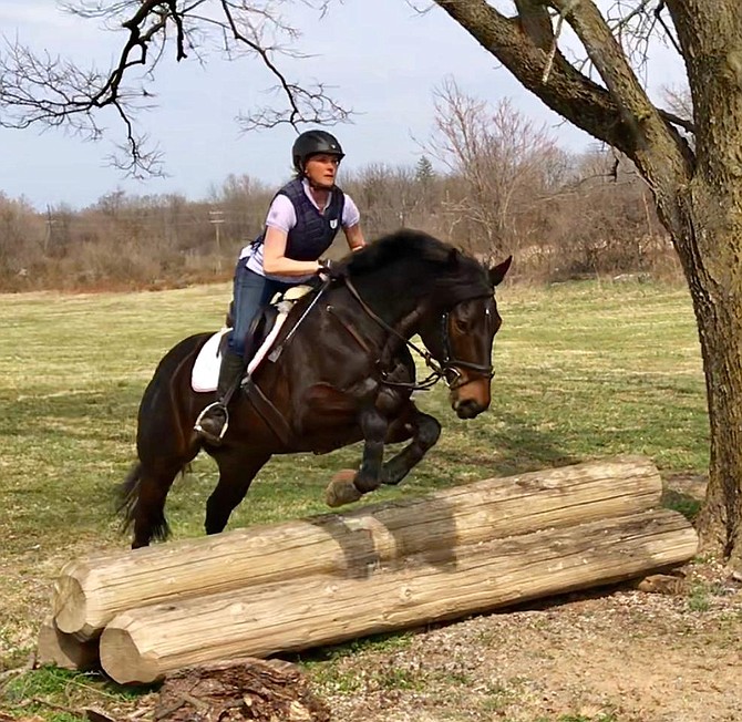 Nicole Doering jumping with her horse in Berryville, Va.