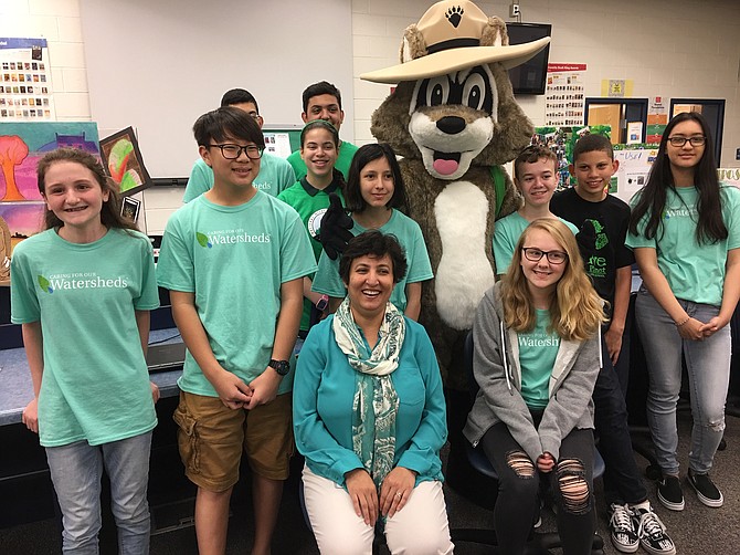 Lanier’s Eco Team members and sponsor Faiza Alam (center, front) pose before the Green Flag ceremony.