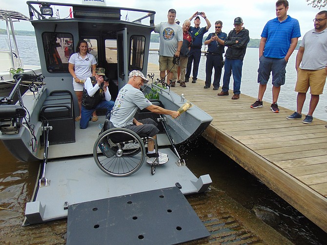 Mike Healy, Marine Corps veteran, christening the boat.