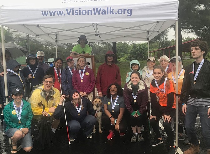 Walkers display their ribbons as the top fundraisers in the May 5 VisionWalk at Cameron Run Park.